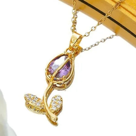 Gold-coloured tulip flower necklace on an adjustable O‑ring chain, shown in one of five colour options.