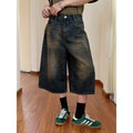 Men's straight loose fit blue denim shorts on a plain background