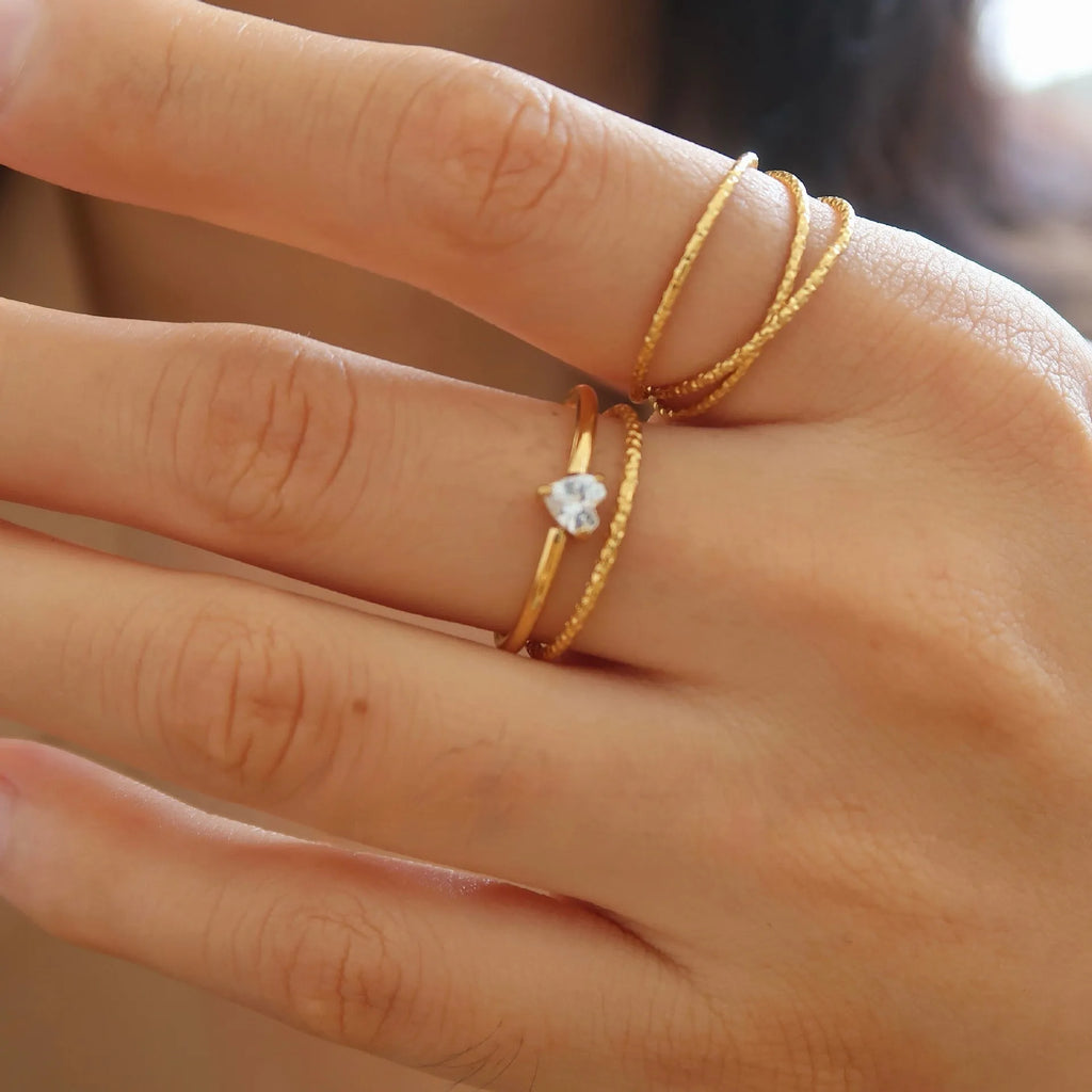 Women's golden heart-shaped stainless steel ring with love design in multiple sizes
