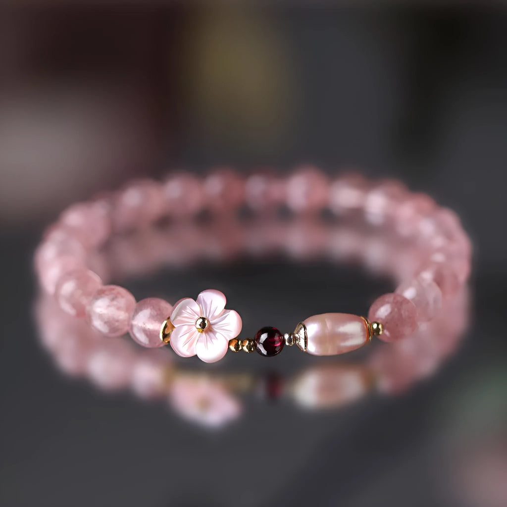 Strawberry quartz crystal bracelet with flower-shaped design on adjustable band for women