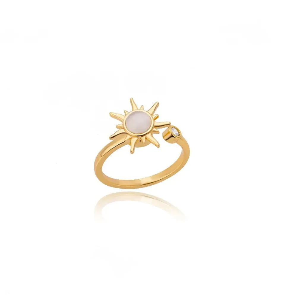 Gold and platinum adjustable geometric decompression spinner rings showing rotatable design