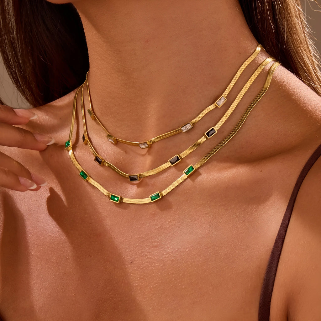 Retro geometric square zircon necklace on a flat snake chain in gold electroplated stainless steel.