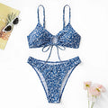 Blue polyester swimsuit three-piece set showing top and shorts, laid flat.