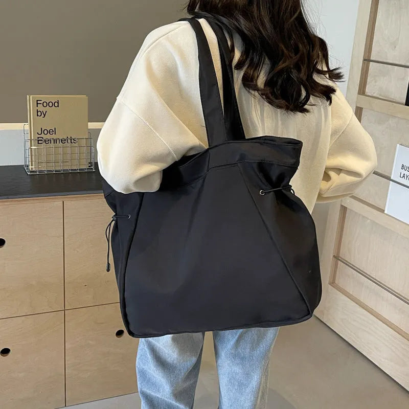 Soft foldable Oxford cloth commuter shoulder tote bag shown in light grey colour.