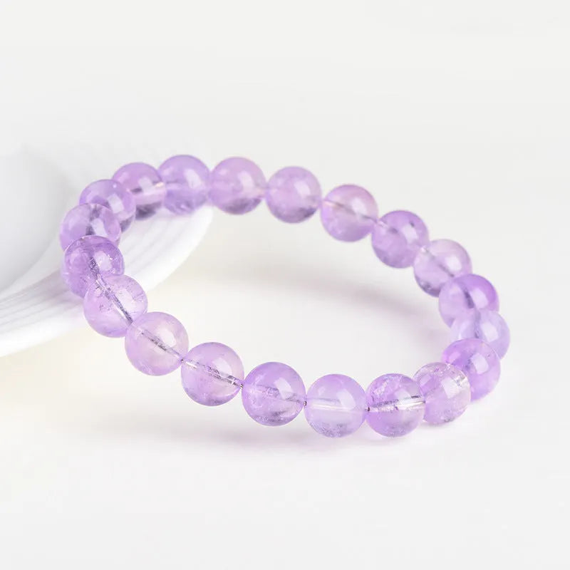 Lavender amethyst crystal bracelet with round beads and water ripple design elements
