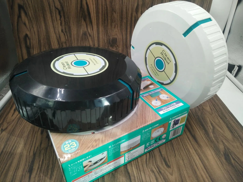 AC robot vacuum cleaner automatic sweeping machine in black or white on a hardwood floor.