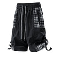 Man's loose-fit cargo shorts in grey with plaid stitching detail on the legs.