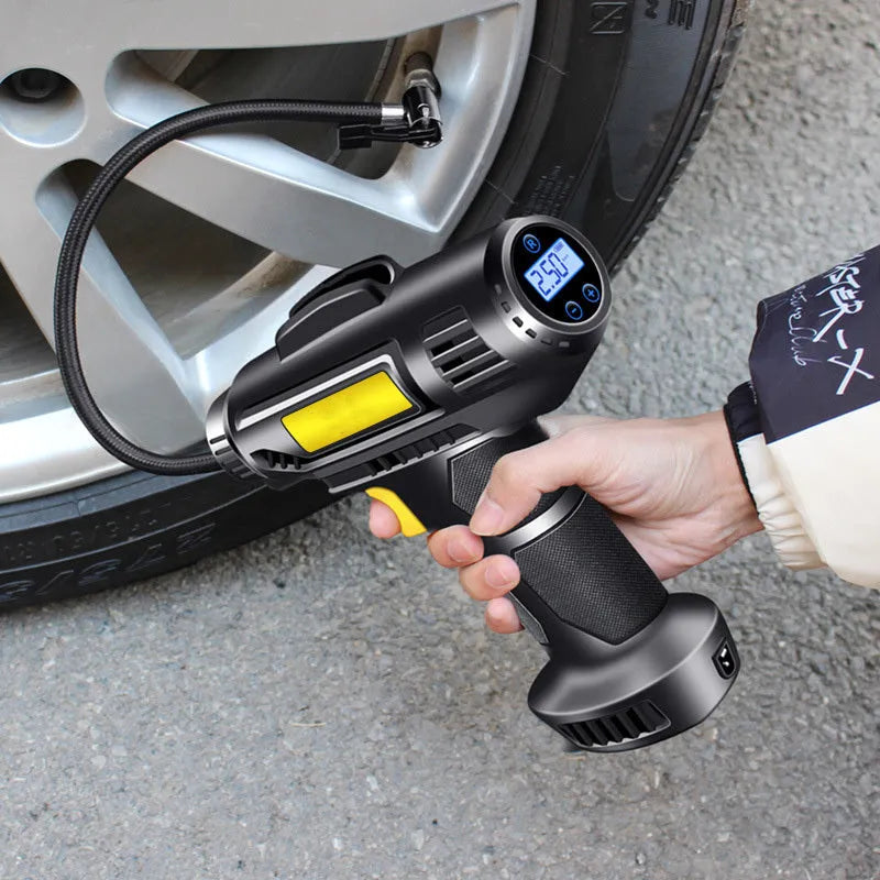 White plastic wireless electric tyre air pump with digital display, charging cable, and three air nozzles on a grey background.