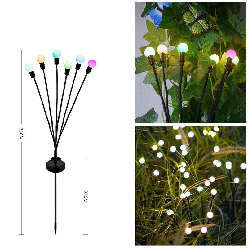 Solar powered LED ground spike garden light with multiple warm white and colour LED heads on stainless steel stake.