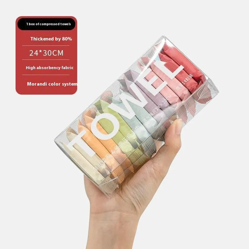 Boxed pack of 14 compressed resin face cloth towels for travel makeup removal, 75g weight