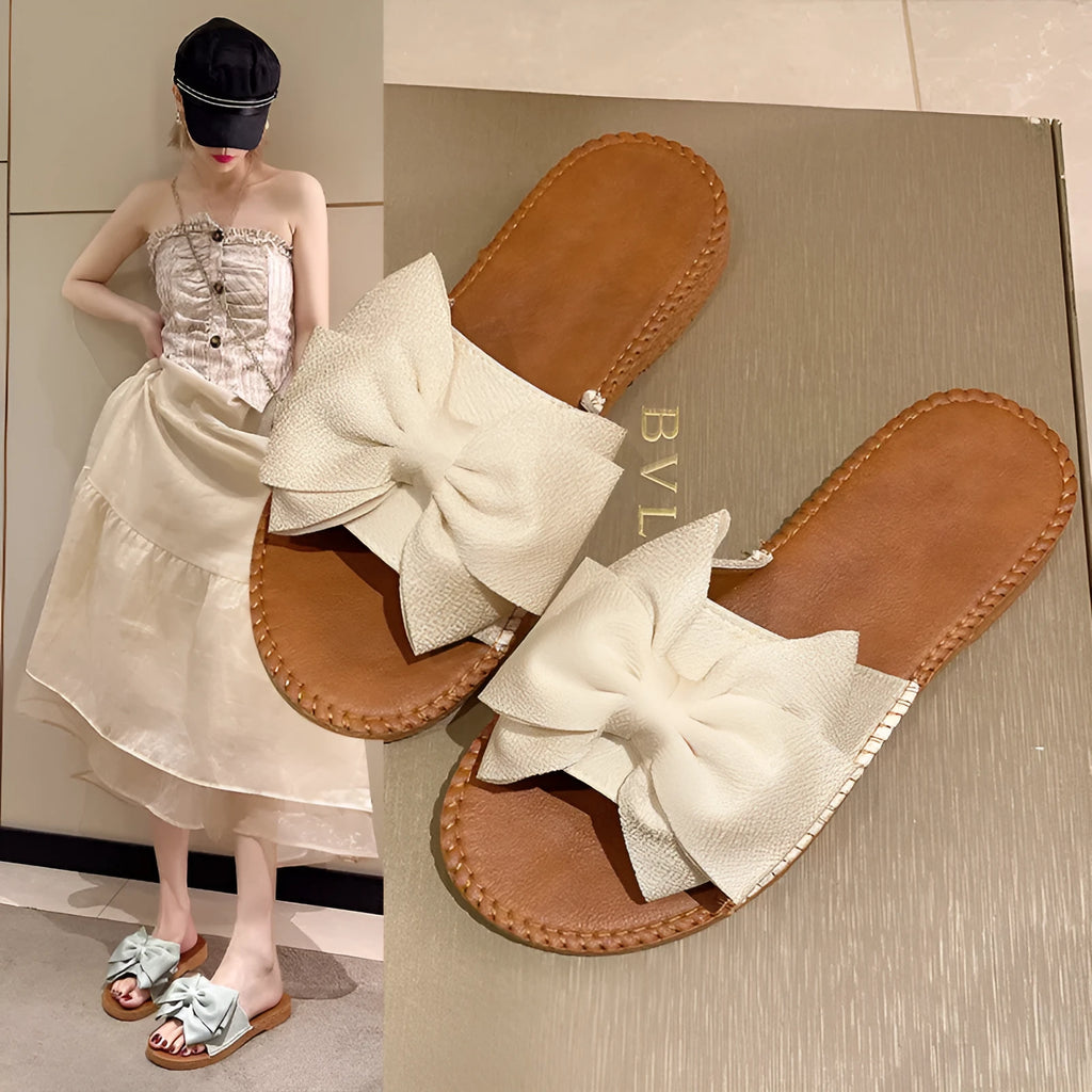 Women's slip-on cloth sandals with suede upper and decorative bow in beige colour
