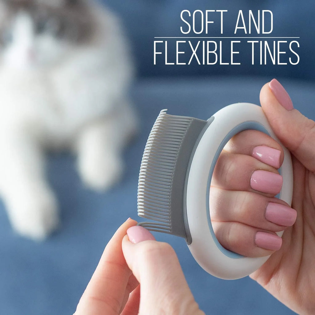 Blue pet grooming comb with soft teeth for deshedding cats and dogs on white background