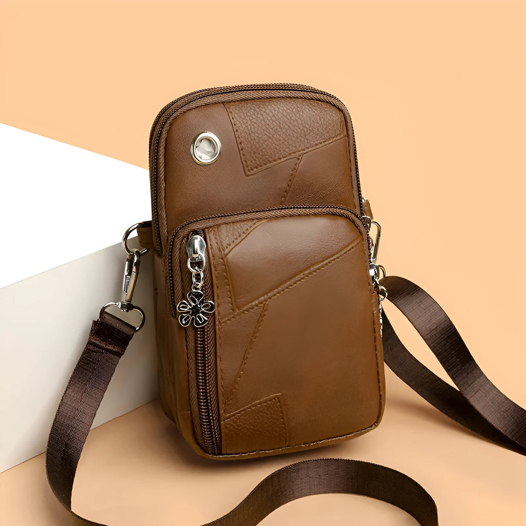 Vertical square mini mobile phone bag in PU leather with an exterior sandwich pocket.