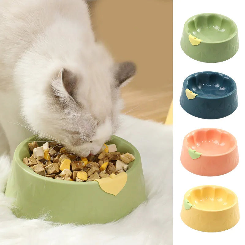 Green plastic double pet bowl for dog and cat food and water on a white background