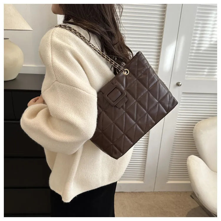 Women's soft PU shoulder bag with chain strap in trapezoid shape, black colour option