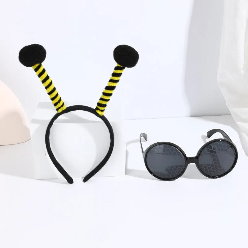 Yellow children's fancy dress set with bee motif headband and matching insect glasses.