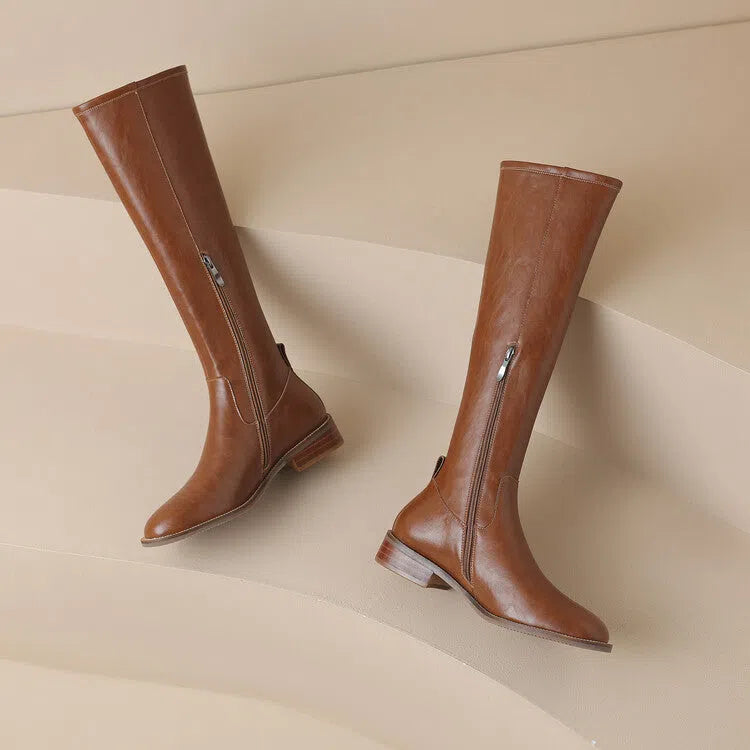 Women's black cowhide leather knee-high riding boots with chunky heel, round toe, and side zipper