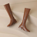Women's black cowhide leather knee-high riding boots with chunky heel, round toe, and side zipper
