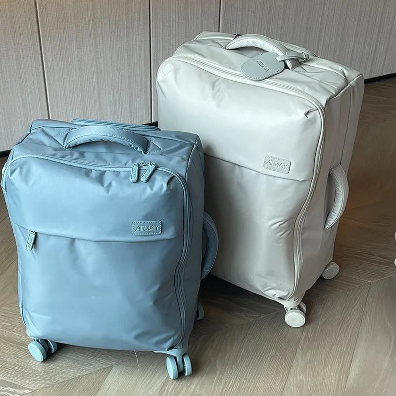Waterproof Oxford cloth suitcase with universal wheels in bluestone green colour showing three size options