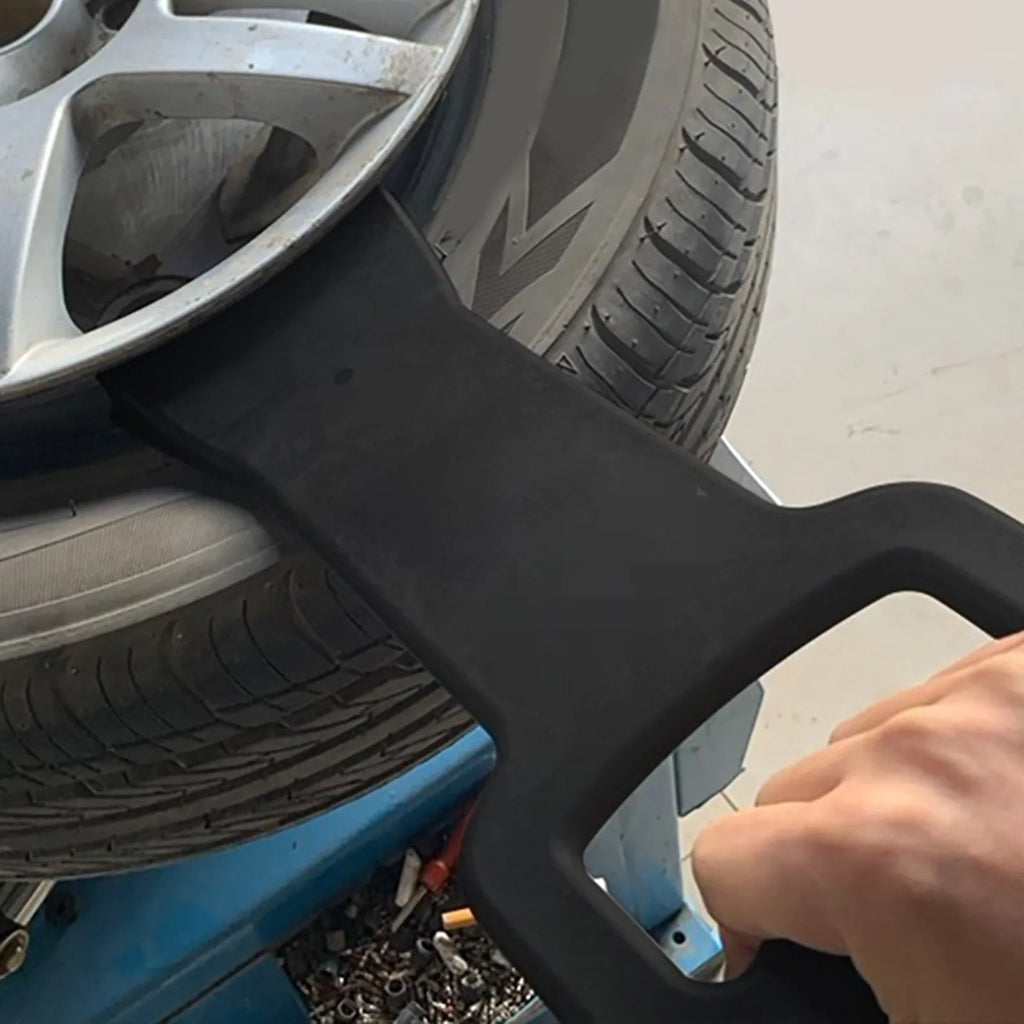 Black composite plastic tyre changer bracket for 17.5 to 24.5 inch tyres, 30cm x 15cm, 530g, wheel guard tool
