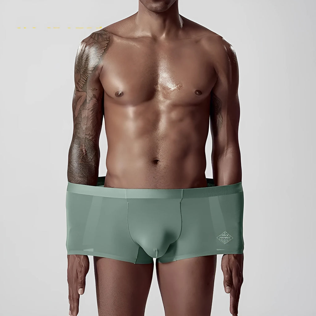 Men's seamless modal underwear in green showing mid-waist design and smooth construction