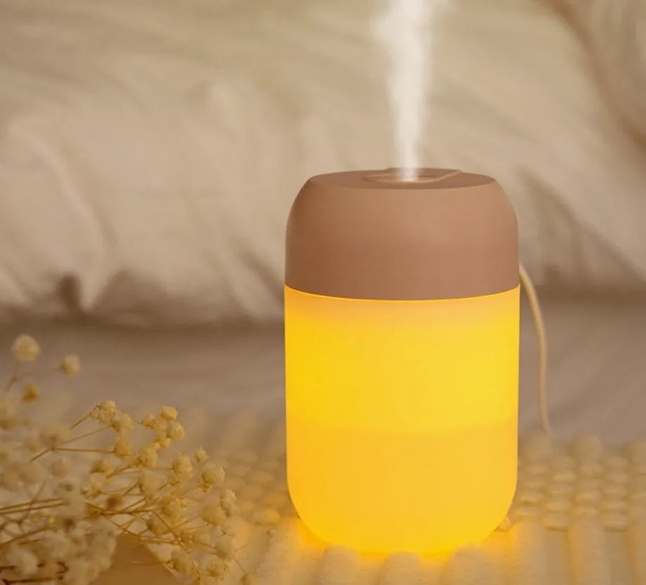 White cylindrical USB-powered mini humidifier with aromatherapy function for essential oils