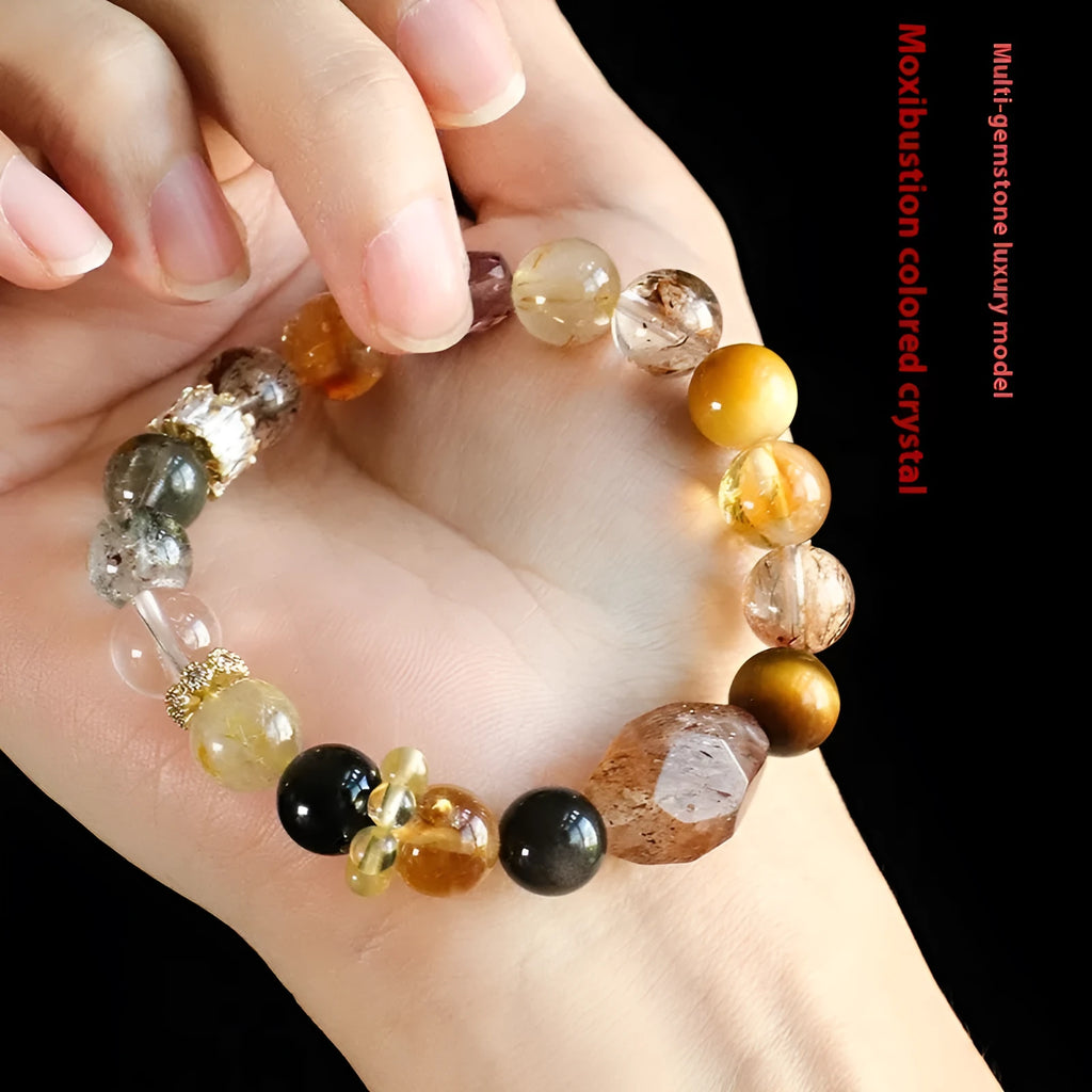 Women's natural crystal bracelet with black gold beads and adjustable slip knot closure.