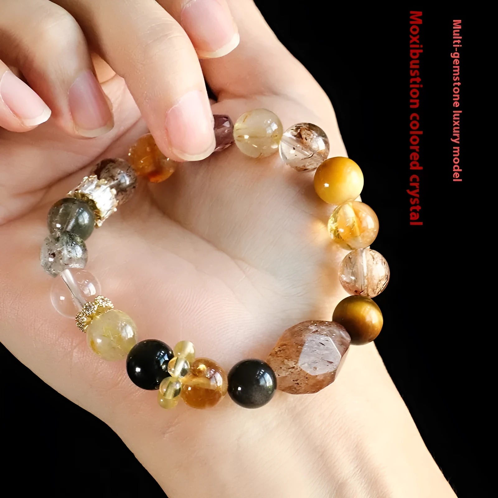 Women's natural crystal bracelet with black gold beads and adjustable slip knot closure.