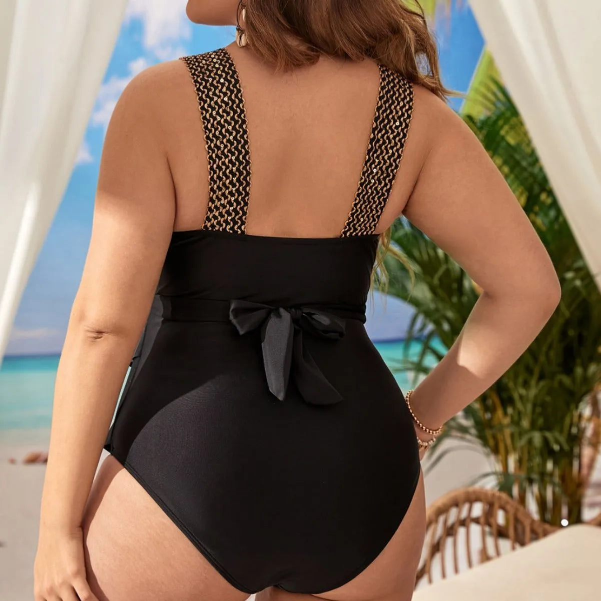 Women's black one-piece sleeveless swimsuit with chest pad on a mannequin, plus-size fit.