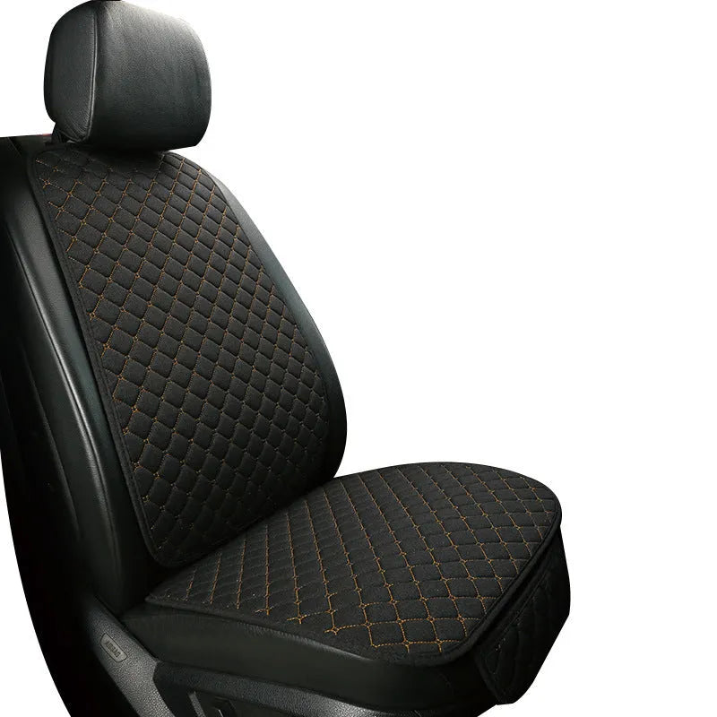 Linen universal car seat cushion with backrest in warm cream colour on a car seat.