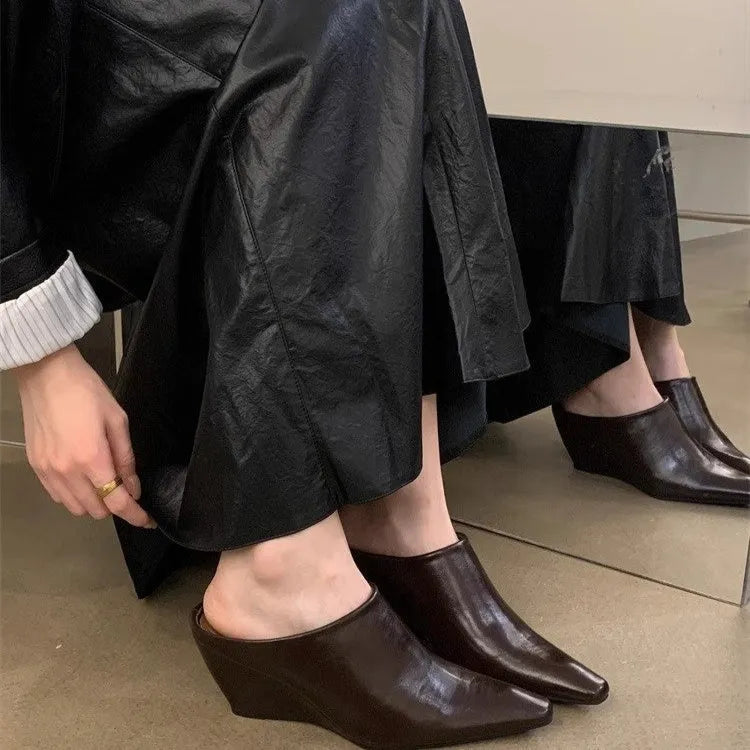 Women's Wind Wedge closed toe half slipper in PU leather, showing wedge heel design.