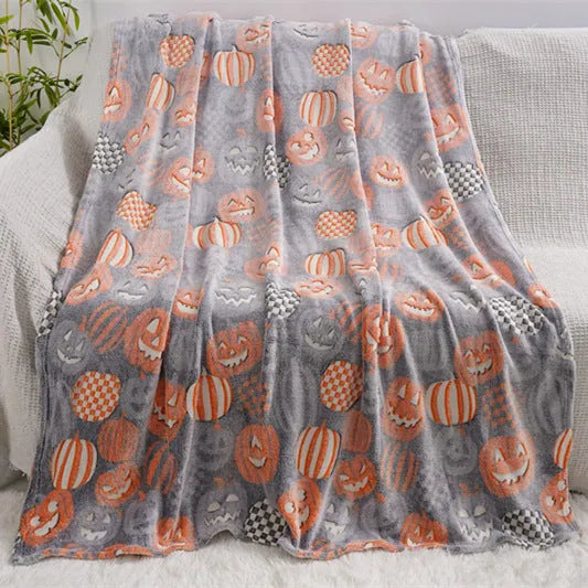 A soft flannel children's blanket with a cartoon pattern, shown in one of five available colours.