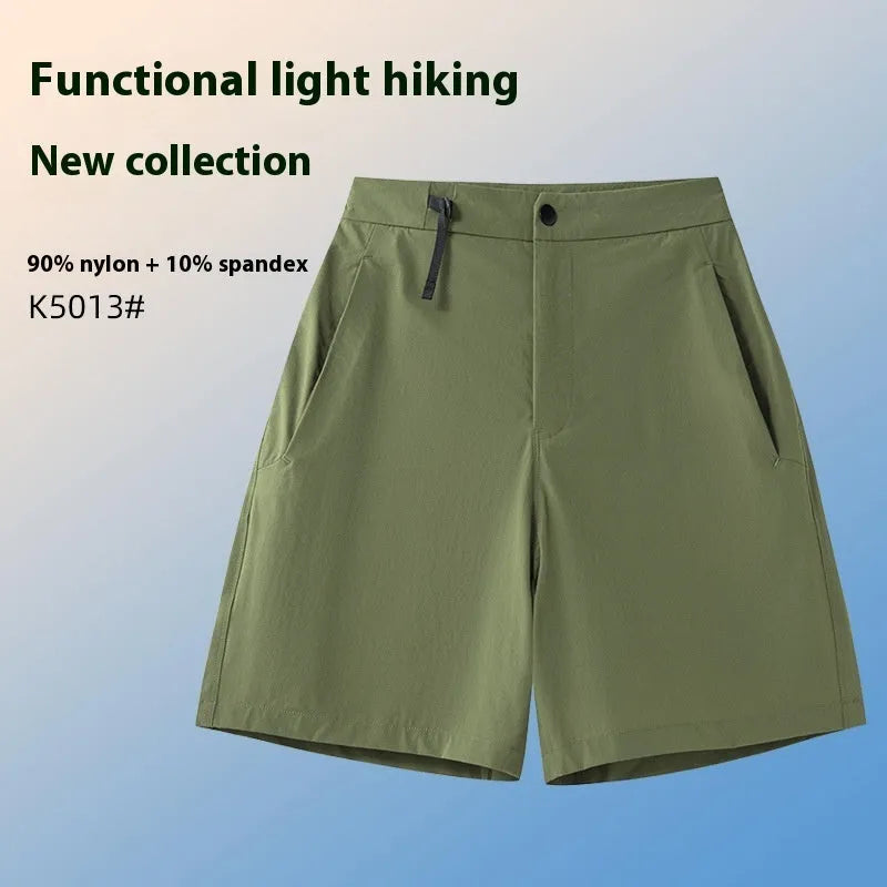 Men's quick-drying sports shorts in a solid colour with elastic waistband and 3D cut leg.
