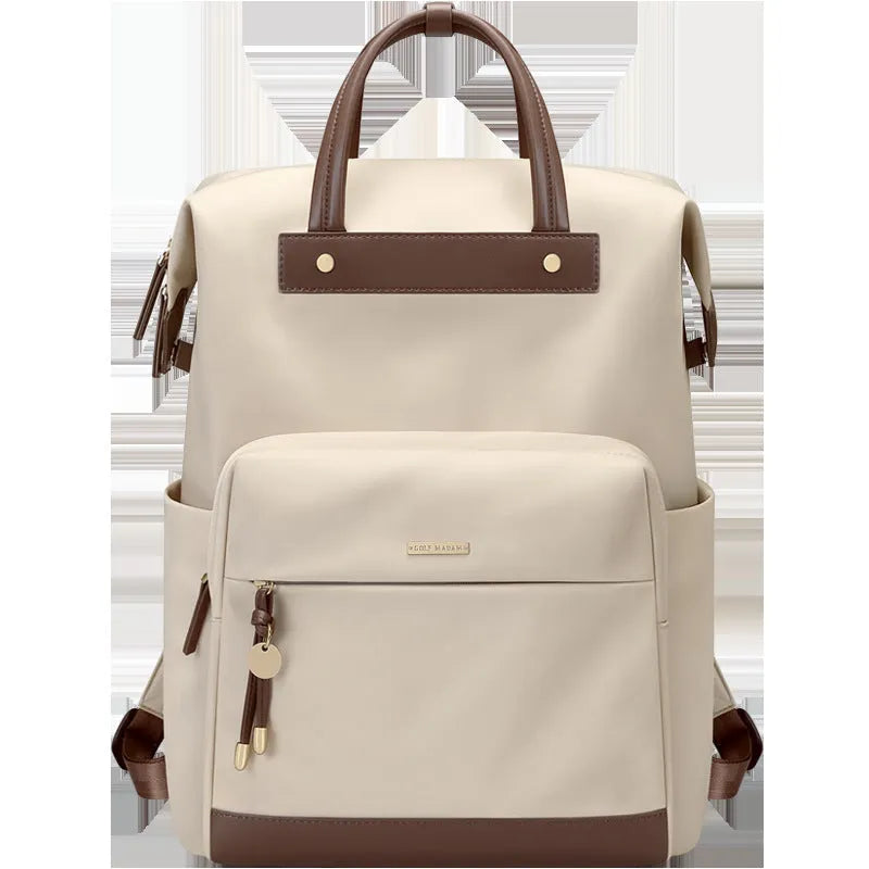 Women's large synthetic leather backpack in apricot colour with adjustable shoulder strap.
