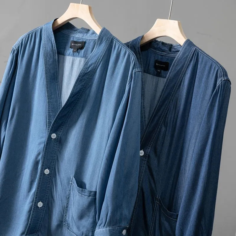 Men's dark blue casual denim coat with V-neck collar and chest pocket on a hanger.