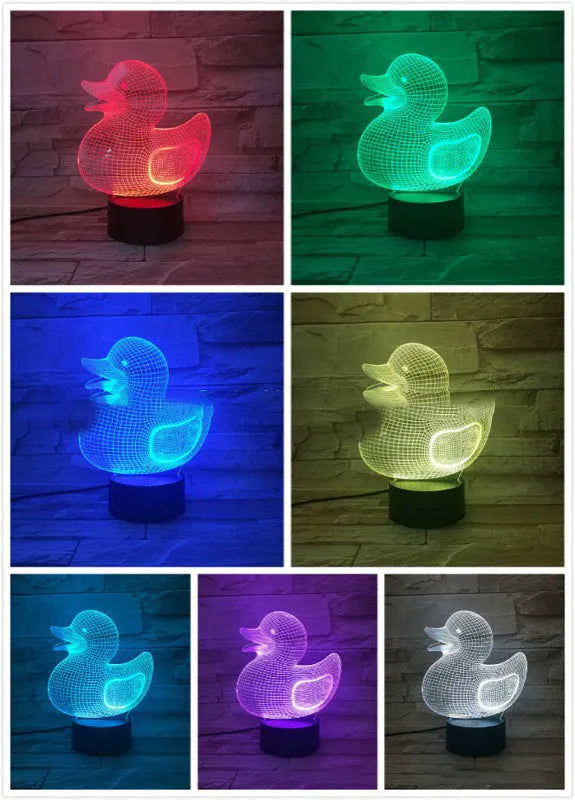 Little yellow duck 3D night light with colour-changing LED display on an ABS base, showing remote control.