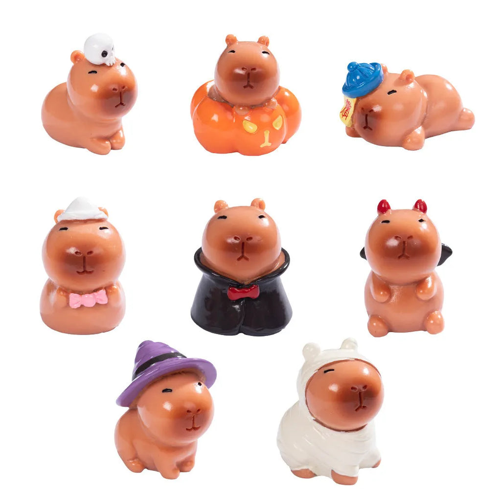 Eight different Halloween-themed capybara resin figurines displayed together
