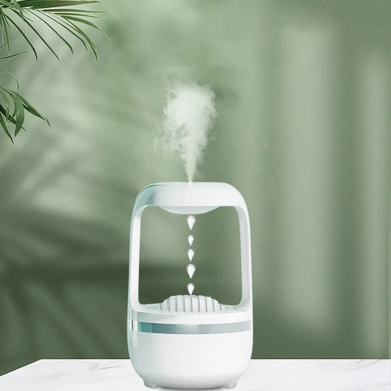 Anti-gravity humidifier with water droplet effect on desk next to USB cable