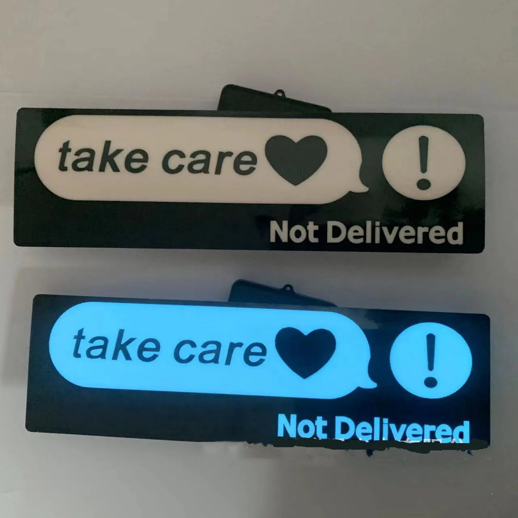 White luminous car sticker in Wanted design, 27cm long and 0.35mm thick, mounted on a car dashboard