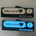 White luminous car sticker in Wanted design, 27cm long and 0.35mm thick, mounted on a car dashboard