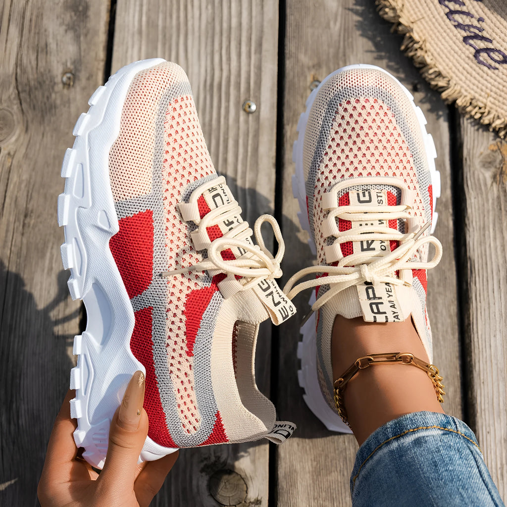 Women's Flyknit mesh lace-up sneakers in low flat heel design for walking and running