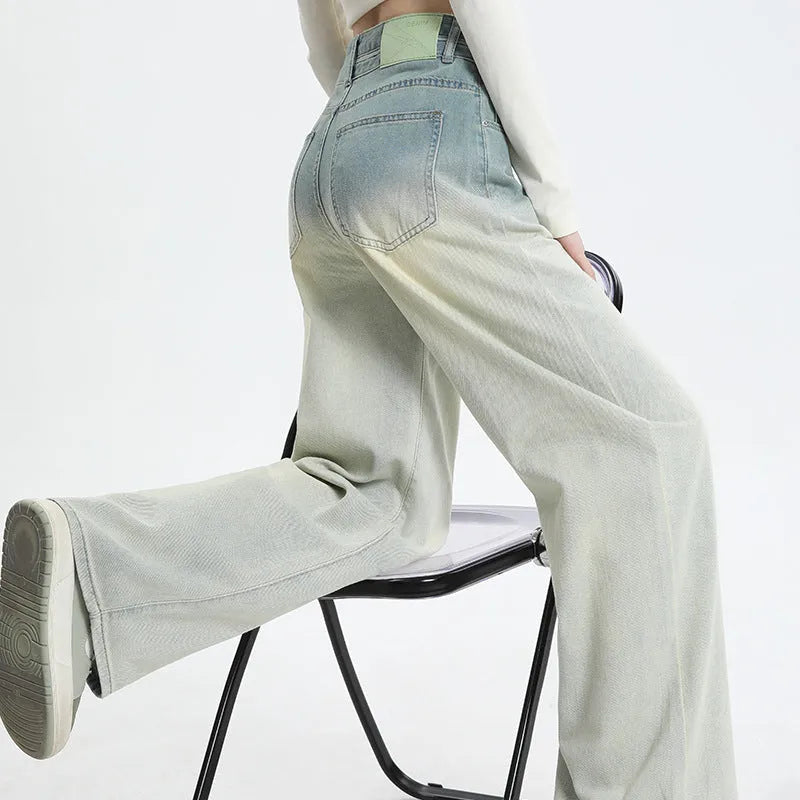 Women's gradient blue straight-leg denim trousers showing colour gradation effect and contemporary cut