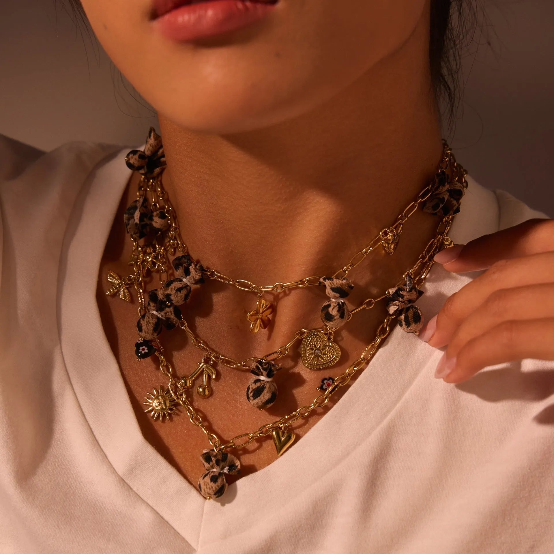 Geometric leopard pendant necklace with love heart and flower engravings on gold-plated chain