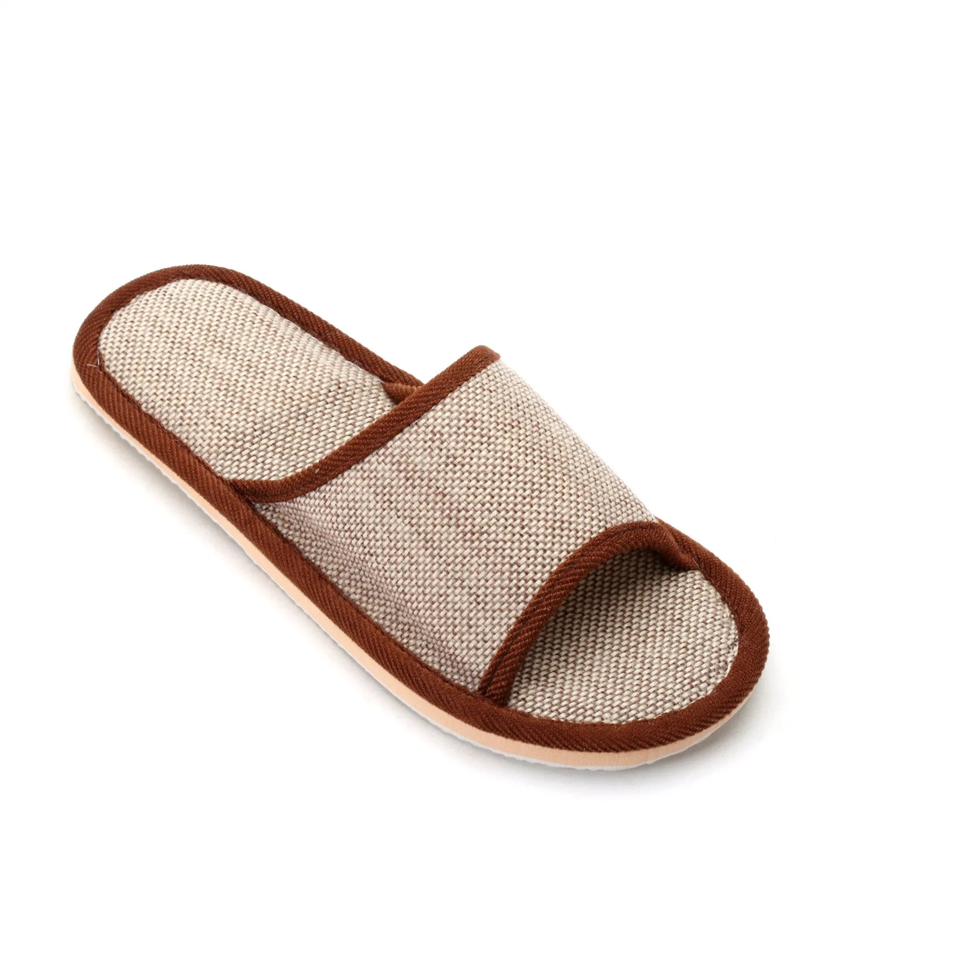 Women's open-toe linen slippers in light brown on a wooden floor, showing the breathable design and thickened sole.