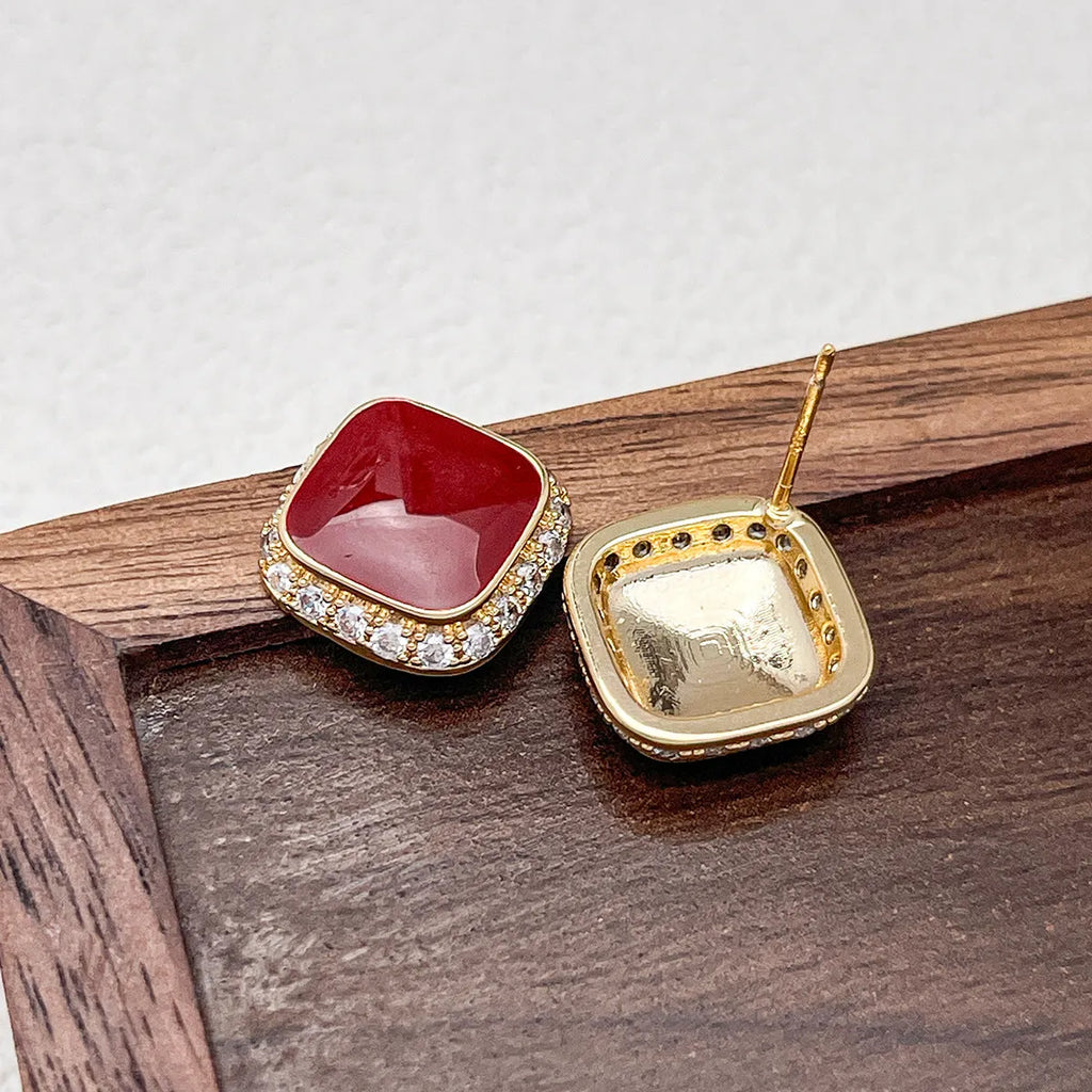 Red square geometric earrings with inlaid design on alloy base