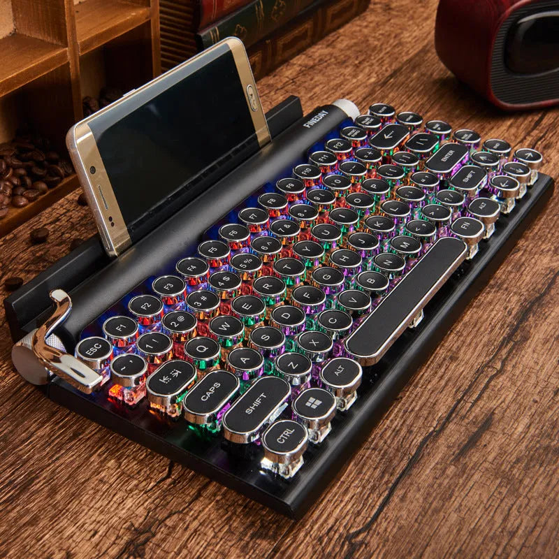 Black dot retro typewriter style Bluetooth mechanical keyboard on a desk.