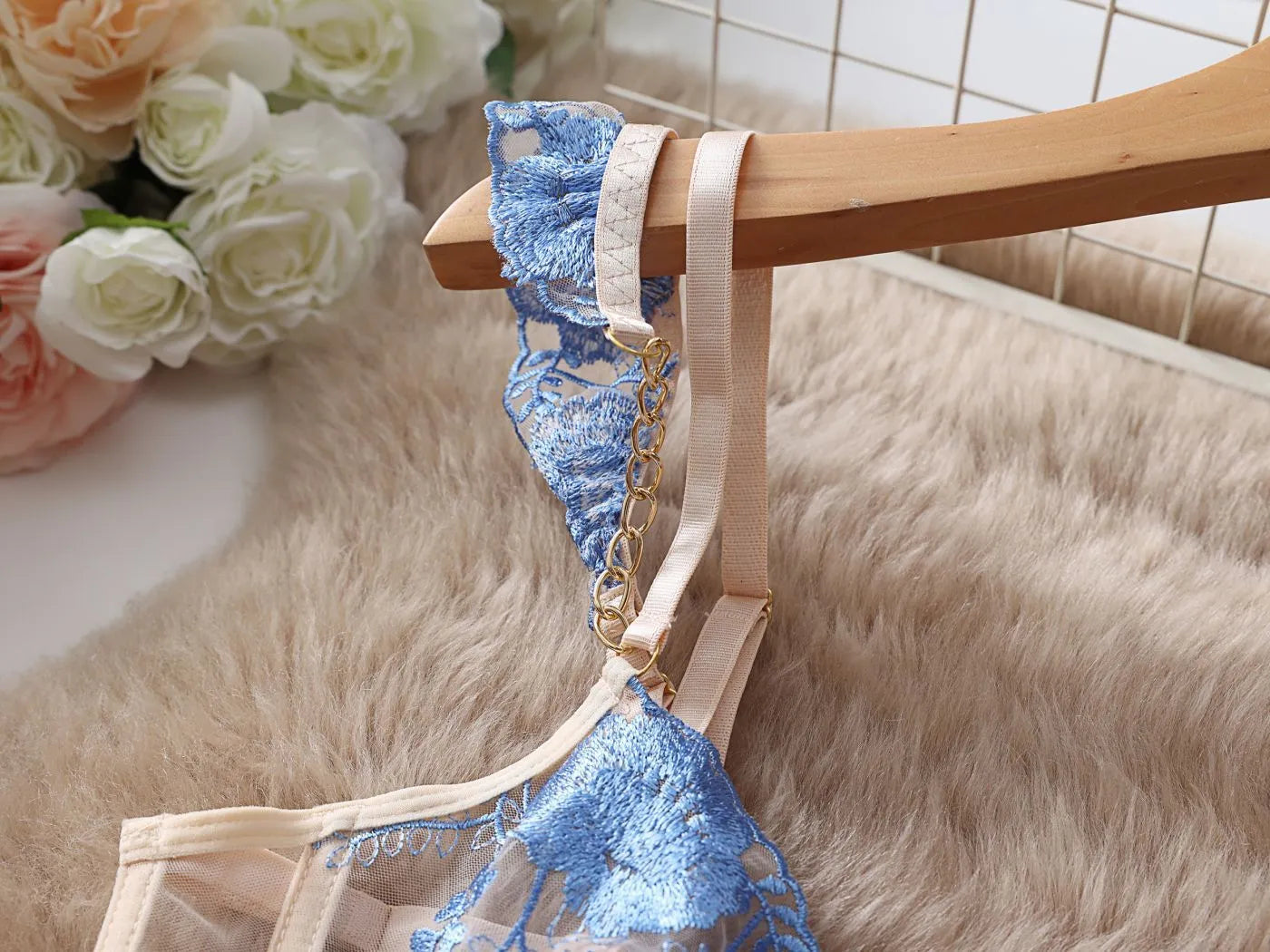 Light blue embroidered lace transparent push up bra and pants set on a mannequin.