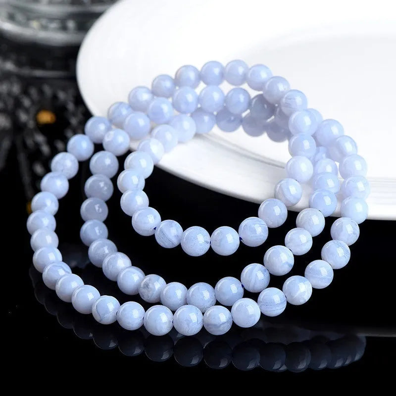 Blue agate bracelet with scattered striped beads and traditional ruyi design elements