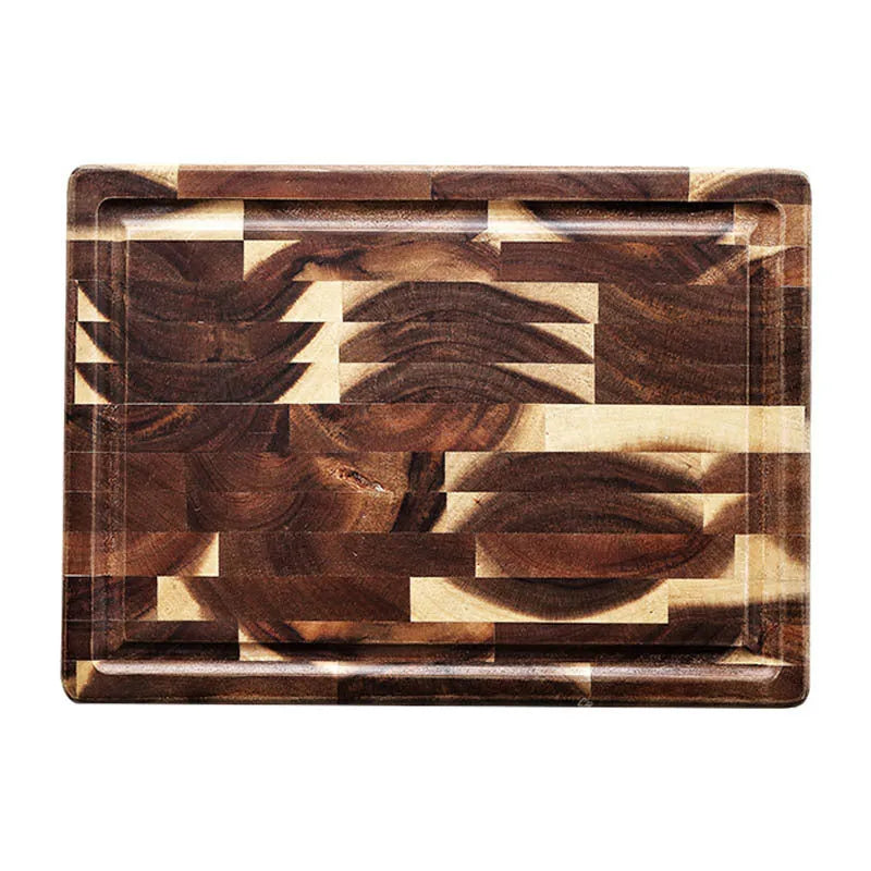 Brown parquet pattern solid acacia wood chopping board on a kitchen counter.