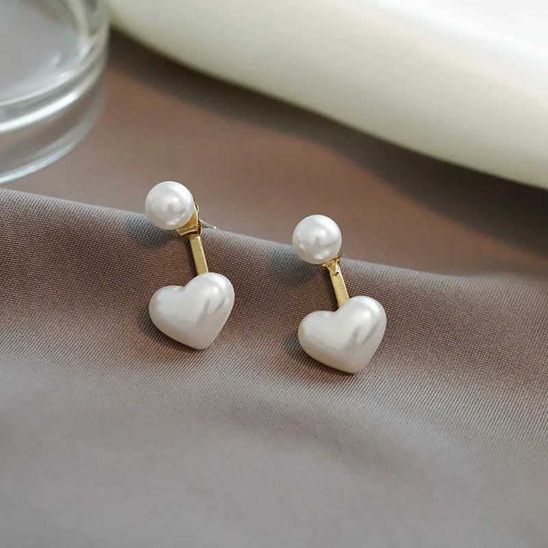 Pair of women's heart-shaped alloy stud earrings with artificial gemstone inlay, Korean style.